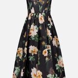 The ZIMMERMANN Luna Corset Midi Dress is a sleeveless black dress with thin straps, a corset bodice, and flared skirt, detailed with a large cream, pink, and green floral pattern.