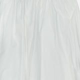 The ZIMMERMANN Mahon Embroidered Midi Skirt features an elastic waistband, delicate embroidery near the hem, and a lightweight, slightly sheer ivory fabric—making it an ideal choice for summer.