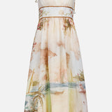 The ZIMMERMANN Mahon Seashell Charm Picnic Dress is a sleeveless, flowy linen midi with thin shoulder ties, a fitted bodice, and sailboat-floral print—ideal for chic picnics or dreamy destination weddings.