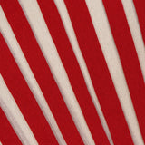 The ZIMMERMANN Rebellion Drawn Cuff Sweater features a bold, cropped fit with dynamic, diagonal red and cream stripes for a visually striking look.