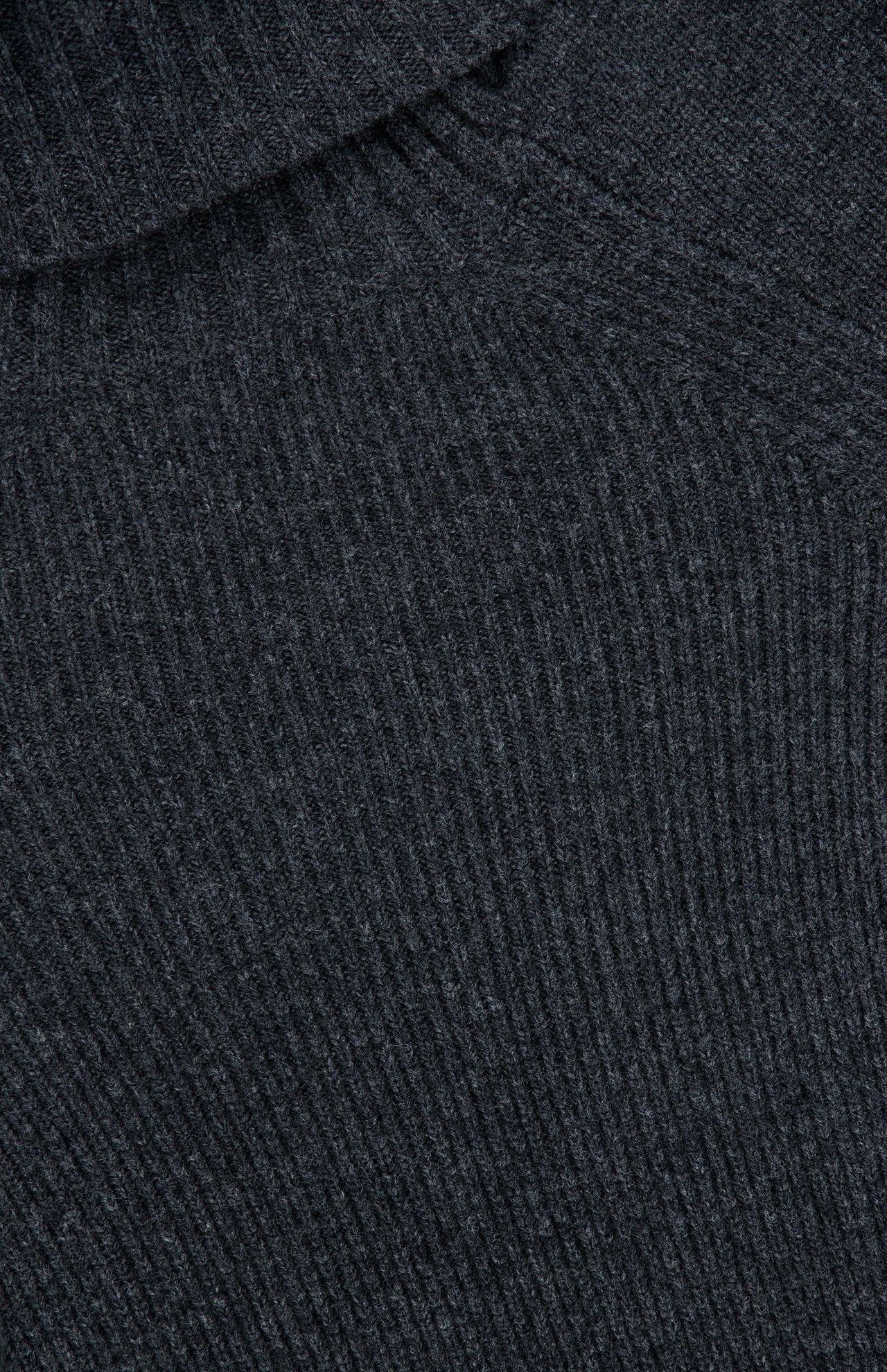 Close-up of the dark gray ribbed knit fabric of the Valiant Buttoned Sweater by ZIMMERMANN, highlighting the texture and pattern of the material.