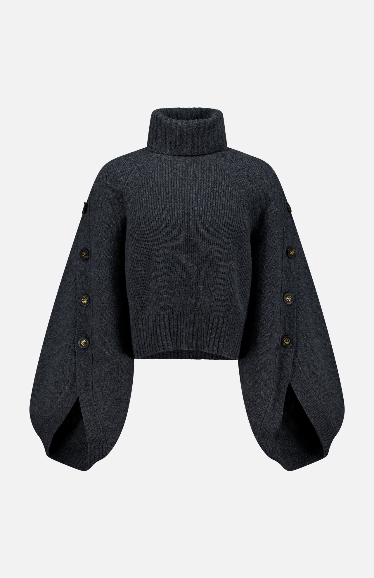 The Valiant Buttoned Sweater by ZIMMERMANN is a dark gray cropped turtleneck with a high neckline and wide, balloon sleeves adorned with button details along the outer seams. Displayed against a plain white background, this statement piece blends modern design and cozy comfort—making it an eye-catching addition to your sweater collection.
