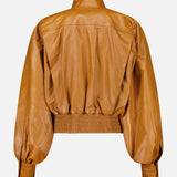 Back view of an amber Zimmermann Valiant Leather Biker Jacket with a high collar, gathered waist, and voluminous sleeves.