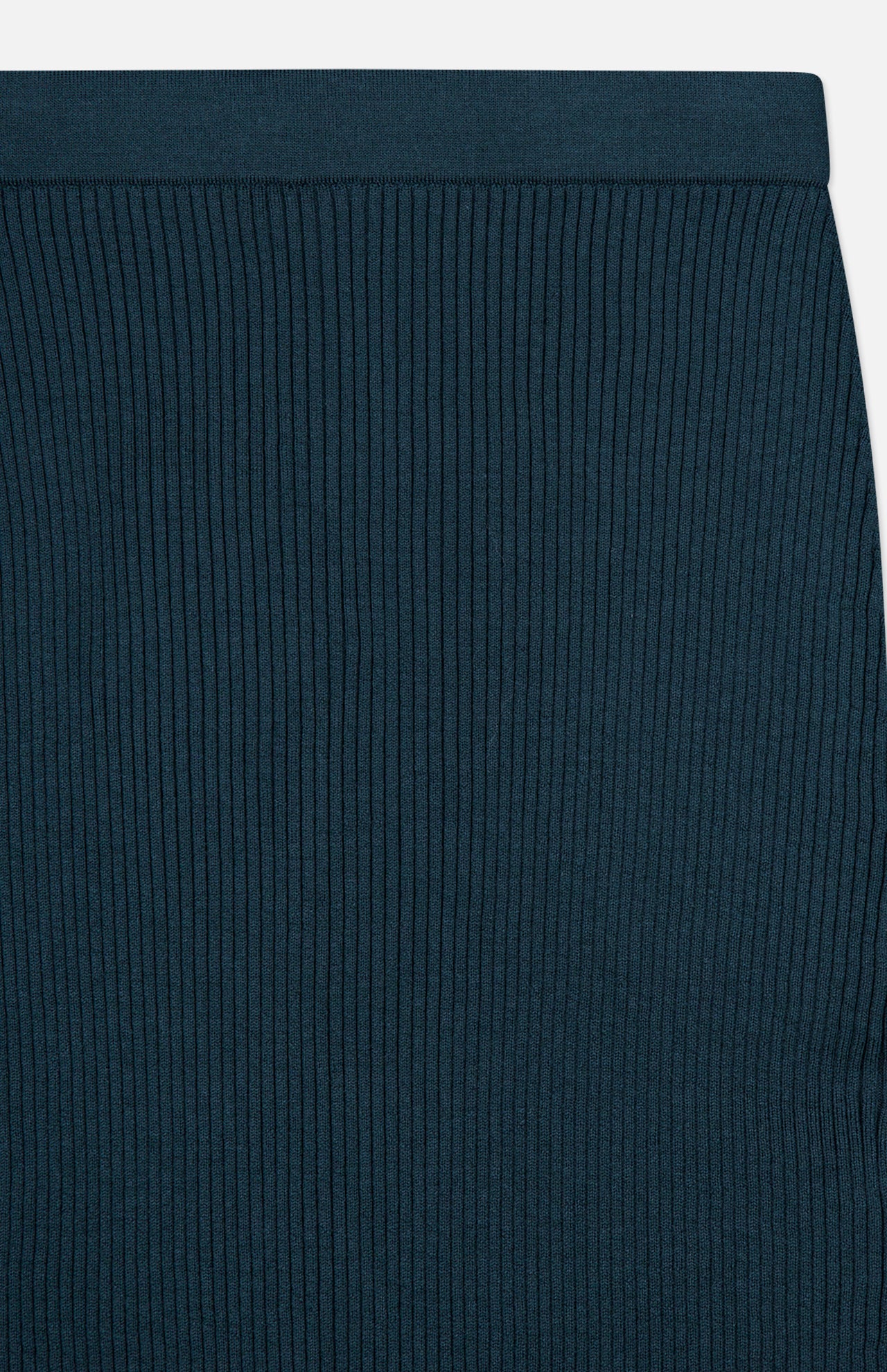 Close-up of the ZIMMERMANN Valiant Merino Straight Midi Skirt in dark teal, highlighting its ribbed knit merino wool fabric with vertical textured lines and a plain waistband at the top.