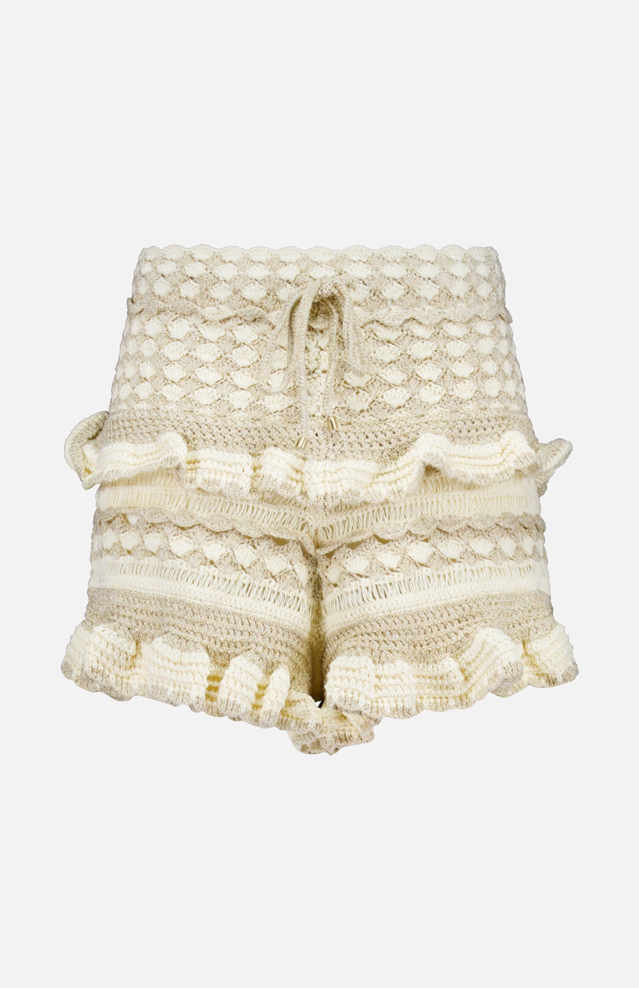 The ZIMMERMANN Wanderlust Crochet Short features a cream hue, high waist, textured crochet pattern, ruffled hems and sides, plus a drawstring waist—perfect summer shorts shown on a plain white background.