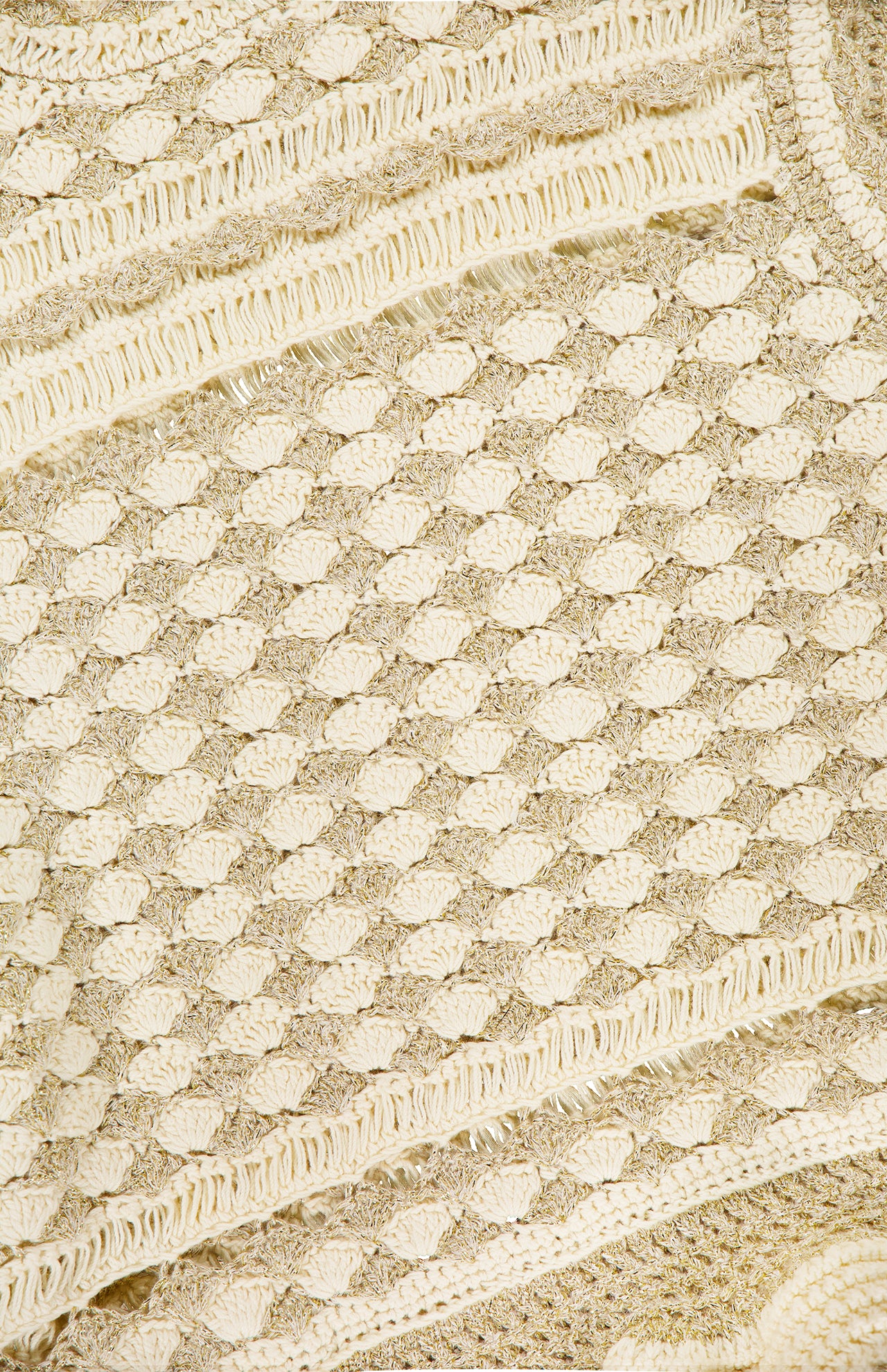 Close-up of the ZIMMERMANN Wanderlust Crochet Tank Top, showing its cream and beige textured knit with a shell-like pattern and ribbed stripes—ideal for creating a chic, handcrafted look.