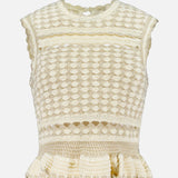 The ZIMMERMANN Wanderlust Crochet Tank Top is a sleeveless, cream top featuring intricate crochet patterns, a round neckline, scalloped edges, and a ruffled peplum hem.