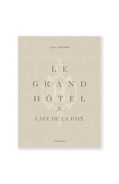 Beige book cover with gold text reading "Le Grand Hôtel & Café de la Paix." A faint decorative crest adds Belle Époque flair. FLAMMARION is printed at the bottom.