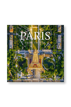 An aerial photo of the Eiffel Tower with lush trees and city streets graces the cover of "Paris: From the Air" by RIZZOLI.
