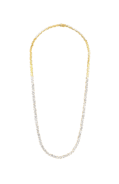 The SUZANNE KALAN Mini Baguette Diamond Tennis Necklace features an elegant oval shape with alternating 18K gold and silver segments, creating a continuous chain design inspired by classic diamond tennis necklaces.